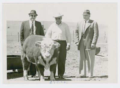 Adolph Rupp, Frank Kimbraugh, and an unidentified man