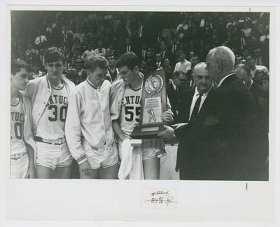 UK vs. Texas Western: Louie Dampier, Tommy Kron, Larry Conley, Thad Jaracz, Adolph Rupp, and Bernie Shively receive 2nd place trophy