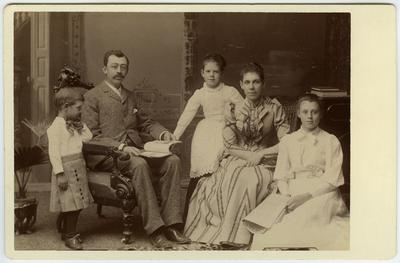 Unidentified man, woman, two young girls, and young boy