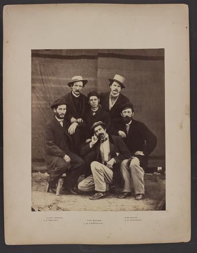Posed group photo; six men, four kneeling, two standing, all wearing coat and tie, bottom of photo reads Isaac Damon, E.P. Knight, F.W. Boyden, J.B. Earnshaw, A.W. Waite, A.A. Livermore