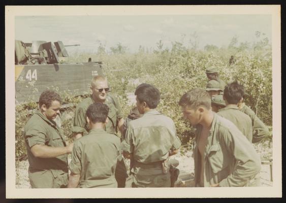 Brigade commander on left, with Vietnamese translators out in the field