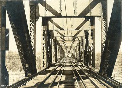 Railroad tracks of High Bridge-men walking ahead