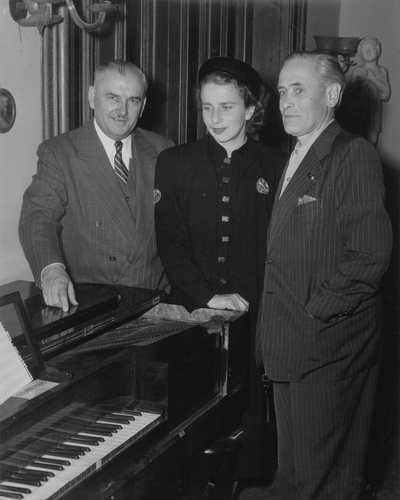 Presentation of Niles' honorary doctor of music degree; Left to Right: Dr. Luther Richman; Rena; and John Jacob Niles; Cincinnati Conservatory of Music