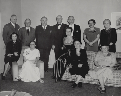 Performance at Indiana University; Dr. Herman B. Wells, President (3rd from left), John Jacob Niles (5th from left), Rena Niles (center); Bloomington, Indiana