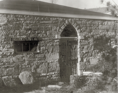 Garage door carved by John Jacob Niles at Boot Hill Farm