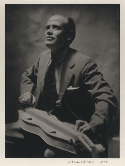 John Jacob Niles playing a traditional purchased dulcimer; New York City; Doris Ulmann-signed and dated