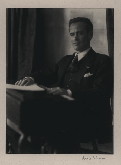 Portrait of John Jacob Niles seated at harpsichord owned by Doris Ulmann, taken at her apartment in New York City; Doris Ulmann-signed
