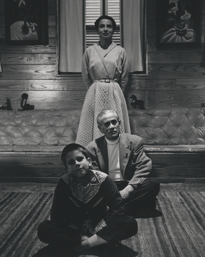 John Jacob Niles and Rena Niles with son on John Ed in living room at Boot Hill Farm; Eugene Meatyard