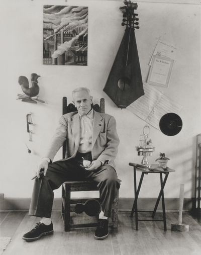 John Jacob Niles seated, surrounded by his interest; Boot Hill Farm; Louisville Courier-Journal