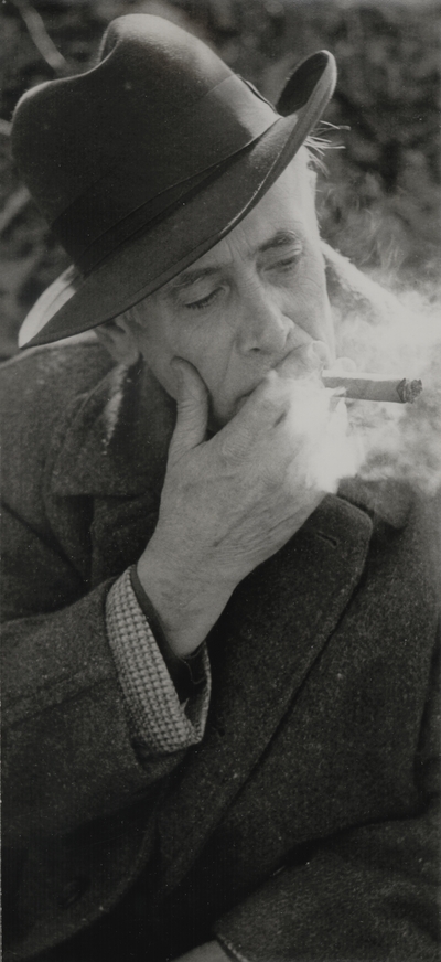 John Jacob Niles smoking a cigar