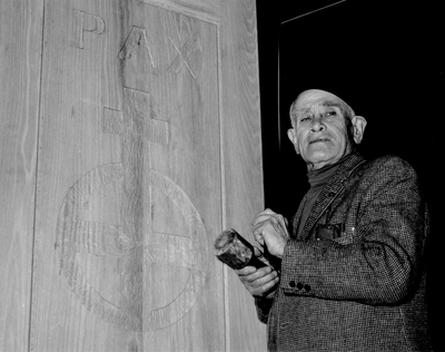 John Jacob Niles carving the doors for St. Hubert's Church, Boot Hill Farm; Jack Cobb