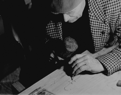 John Jacob Niles carving the doors for St. Hubert's Church, Boot Hill Farm; Jack Cobb