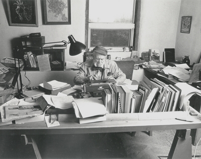 John Jacob Niles working on autobiography at typewriter in pony barn; Boot Hill Farm; Steve Mitchell