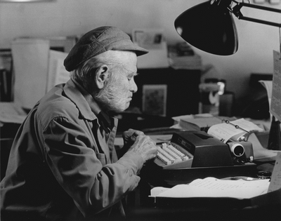 John Jacob Niles working on autobiography at typewriter in pony barn, Boot Hill Farm; Steve Mitchell