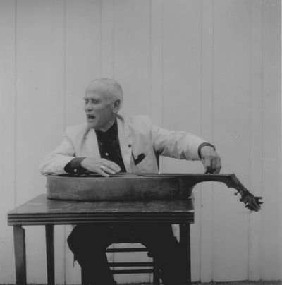 John Jacob Niles posed with dulcimer; Boot Hill Farm; Eugene Meatyard