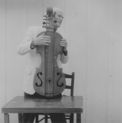 John Jacob Niles posed with dulcimer; Boot Hill Farm; Eugene Meatyard