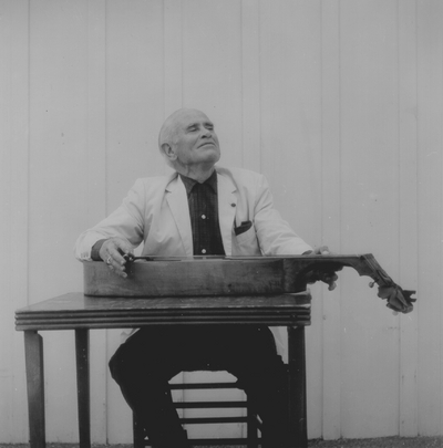 John Jacob Niles posed with dulcimer; Boot Hill Farm; Eugene Meatyard