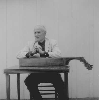 John Jacob Niles posed with dulcimer; Boot Hill Farm; Eugene Meatyard