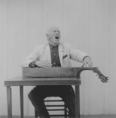 John Jacob Niles posed with dulcimer; Boot Hill Farm; Eugene Meatyard