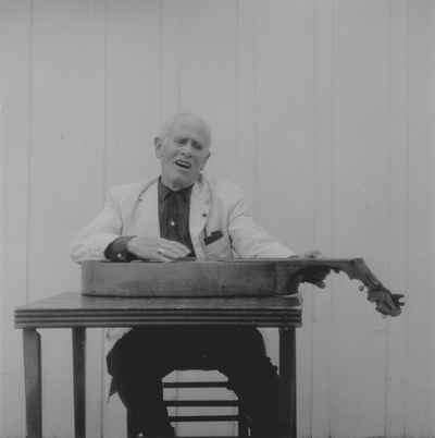 John Jacob Niles posed with dulcimer; Boot Hill Farm; Eugene Meatyard