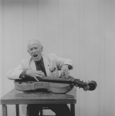 John Jacob Niles posed with dulcimer; Boot Hill Farm; Eugene Meatyard