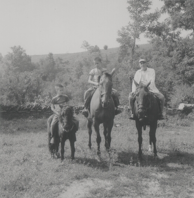 On horseback at Boot Hill Farm; Left to right: Rena, John Ed, Tom, and John Jacob Niles