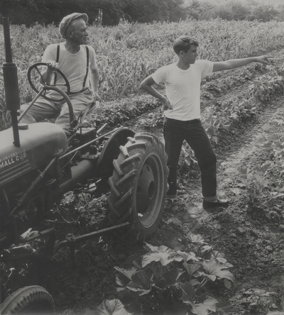 John Jacob Niles on tractor with Tom Niles in a field on Boot Hill Farm; Van Coke