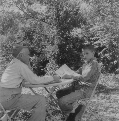 John Jacob Niles with John Ed Niles outdoors at Boot Hill Farm