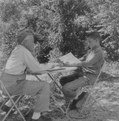 John Jacob Niles with John Ed Niles outdoors at Boot Hill Farm