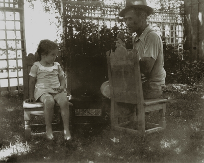 Chair caner with unidentified girl possibly daughter
