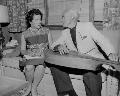 John Jacob Niles being interviewed by a female journalist