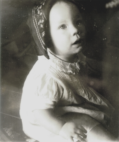 Finnish child wearing traditional headdress; photo given to John Jacob Niles at a concert in Finland