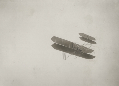 First Wright aeroplane model built after trial flights at Kitty Hawk, North Carolina; Orville Wright up; Paul Thompson