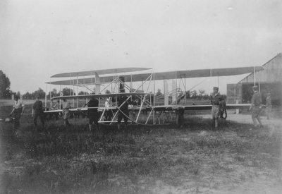 Wright Brother's aeroplane leaving the barn to be put on the slide; Paul Thompson