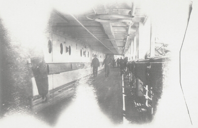 Photo on board ship: military personnel on walkway