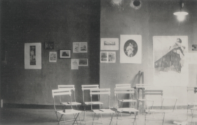 Photo of a studio with books placed on chairs