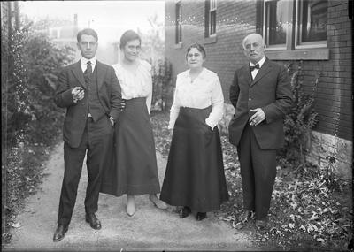 2 couples standing together outside