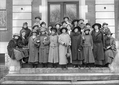 women, group portrait on building steps