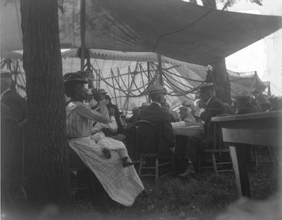 1902 Elks Fair, group of people sitting under a tent