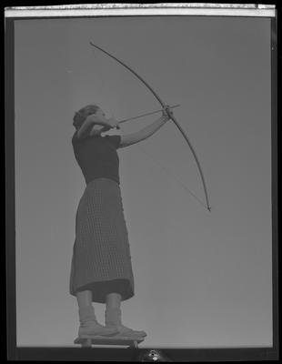 Young woman w/ bow and arrow