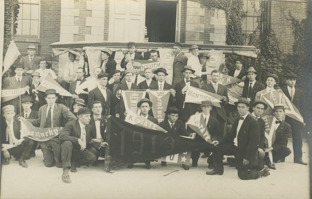 group portrait of unidentified men holding a 