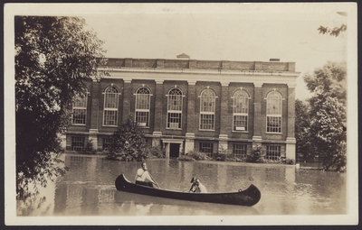 Men's Gymnasium, Alumni Gym; Three people in canoe during flood