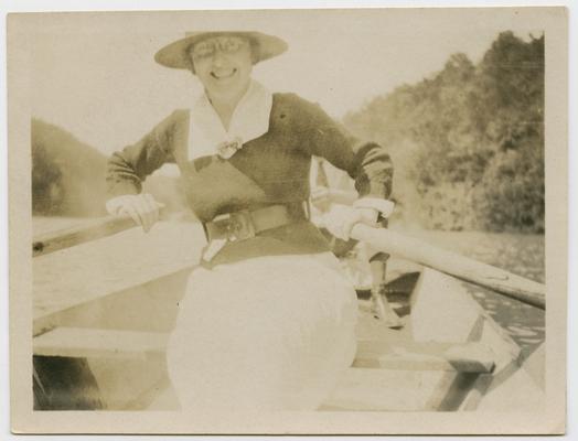 Linda [rowing in a row boat] on Kentucky River, native of Kentucky