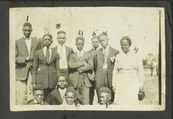 Page 3 [R]: Ten unidentified black men and one woman in a group