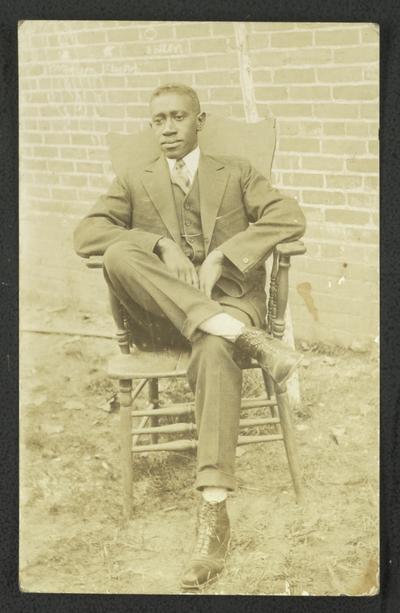 Portrait of an unidentified black man sitting in a chair