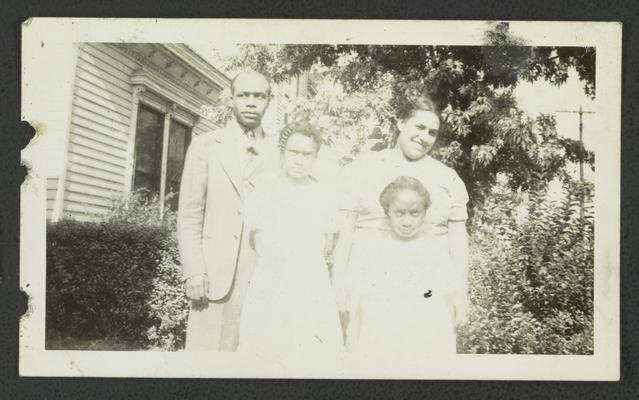 The family of F.A. Wilson, Elah Shinetta Wilson (now Mrs. Stevenson), Mrs. Earnestine Wilson (now Mrs. Ross), miss Florestine Wilson, Back row [L to R]: Florizel Wilson, Earnestine Wilson; front row [L to R]: Elah Wilson, Florestine Wilson