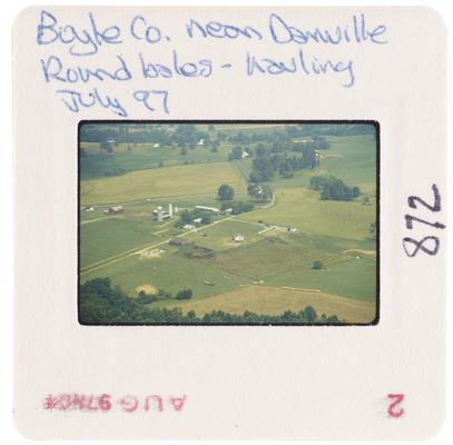 Boyle County near Danville, round bales - hauling