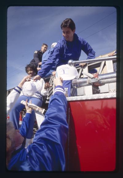 Rick Pitino signs autographs in UK parade