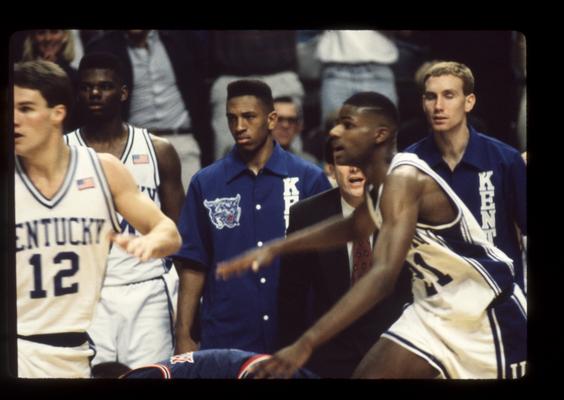 Deron Feldhaus and Henry Thomas on floor, Mashburn, Braddy, Pelphrey on bench; Rick Pitino in background; UK vs. Ole Miss