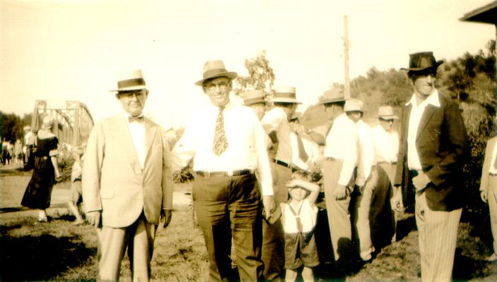 Group of men and one child